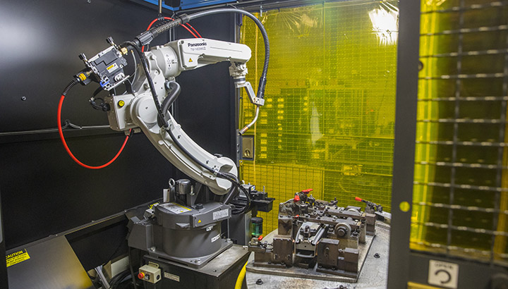 Welding robot and tooling inside of robotic welding cell