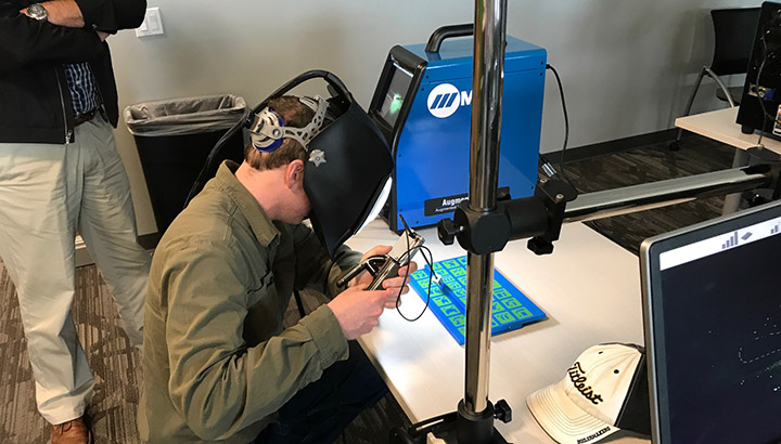 Student practicing stick welding technique on 3-D image, using the AugmentedArc augmented reality system
