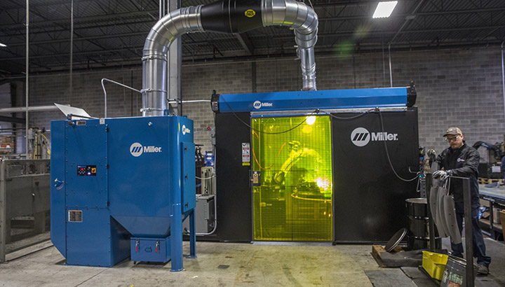 Miller robotic welding cell connected to centralized fume extractor