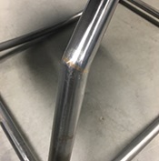 Silicon bronze filler metal creates a gold finish weld on the frame