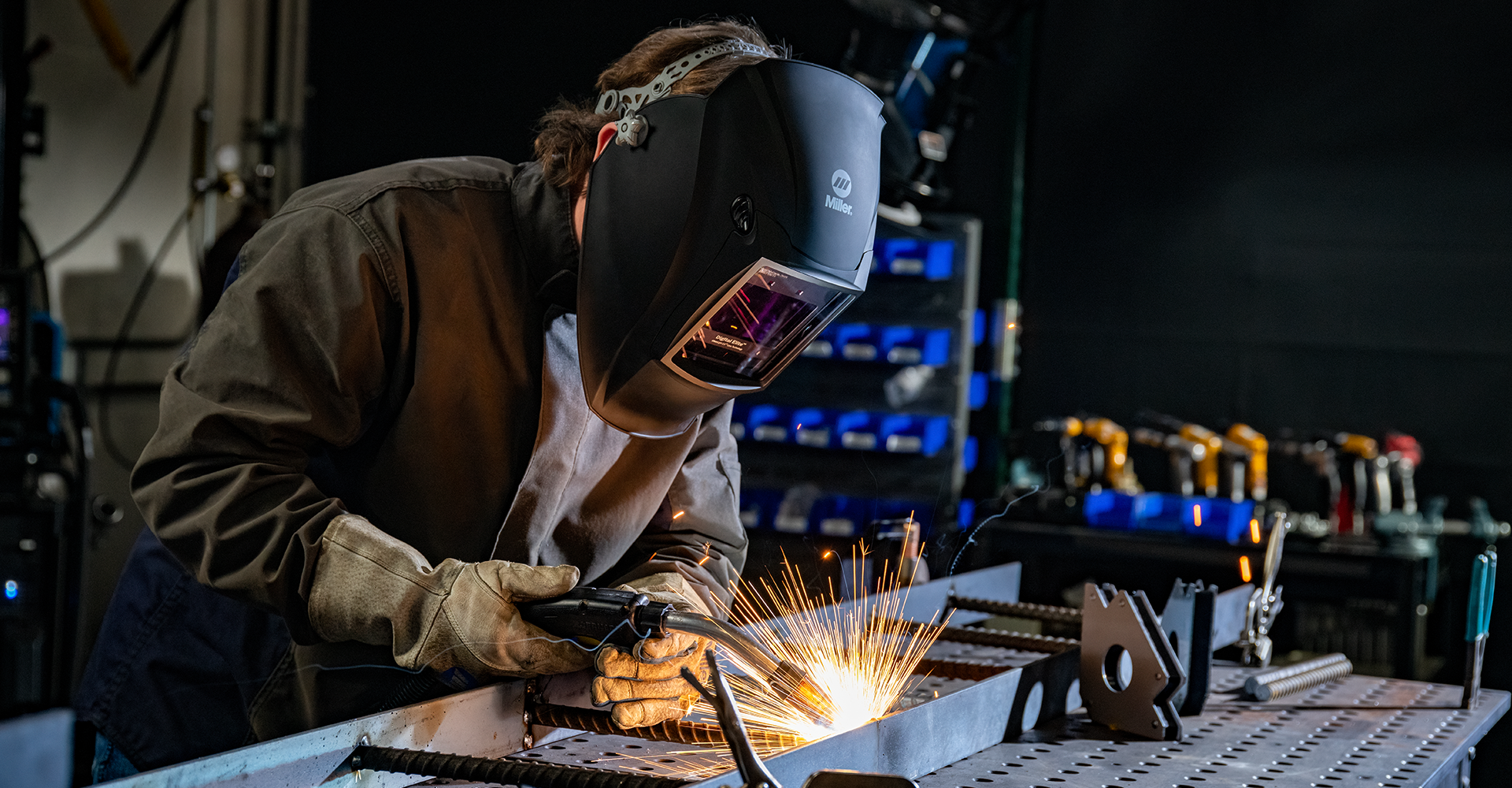 welder welding with a miller helmet
