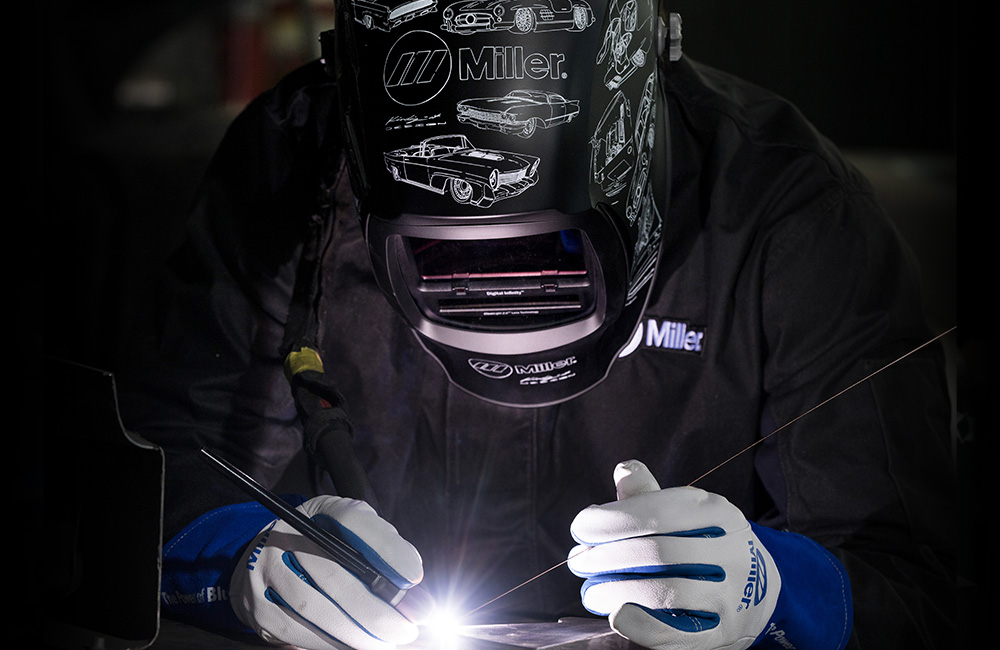 Dave Kindig TIG welding wearing his ’22 Custom Kindig-it Design Helmet