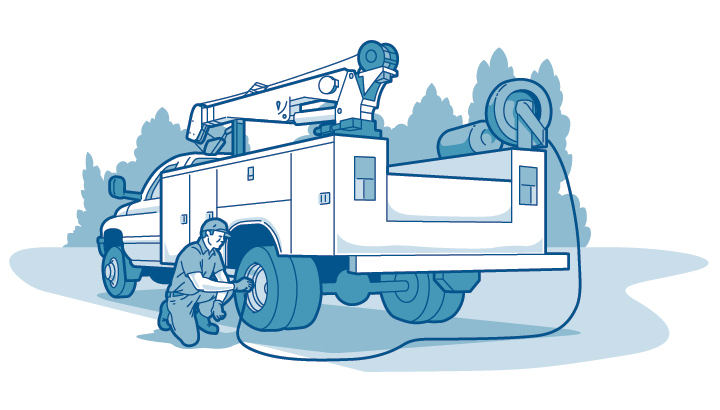 Illustration of a technician airing up tires on a service truck with a crane