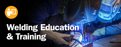 Welding Education and Training. Image of an instructor observing a student MIG weld.