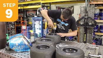 Tom Patsis screwing wheels hubs to tires